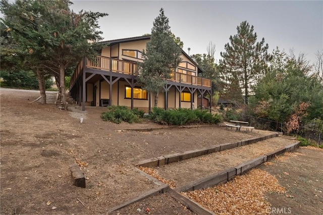 rear view of property with a deck