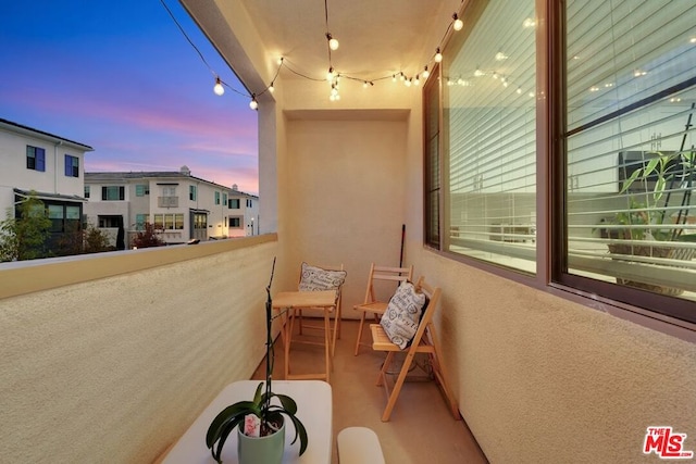 view of balcony at dusk