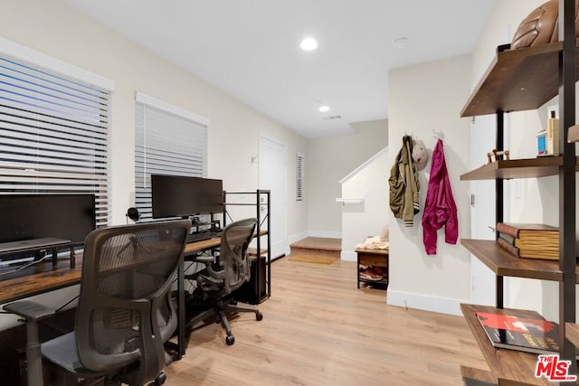 office space with light hardwood / wood-style flooring