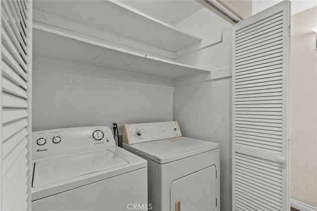 laundry area with washing machine and clothes dryer