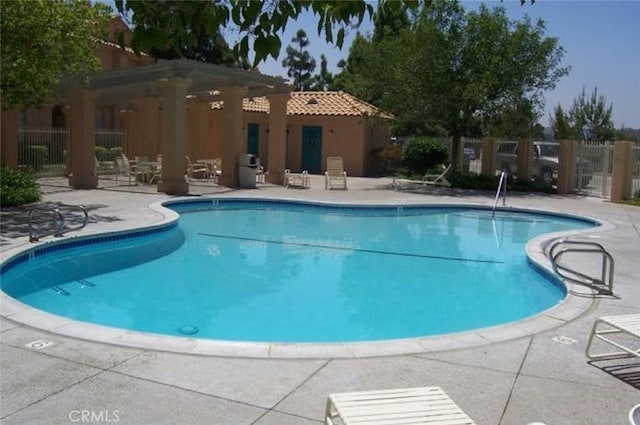 view of pool featuring a pergola and a patio area