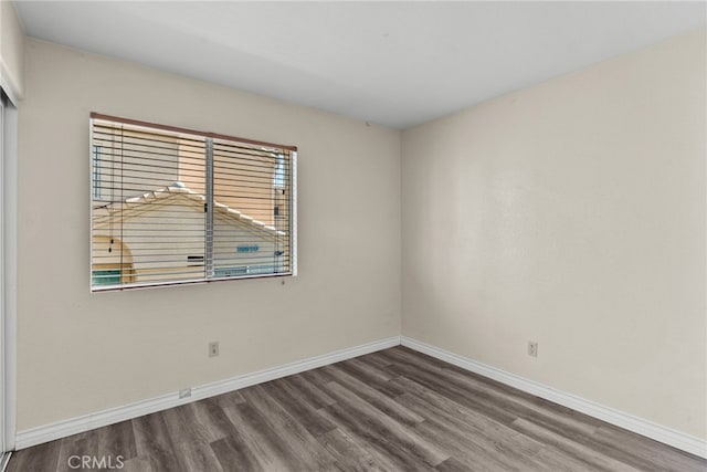 empty room with hardwood / wood-style flooring