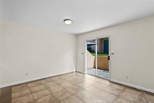 spare room featuring light tile patterned floors