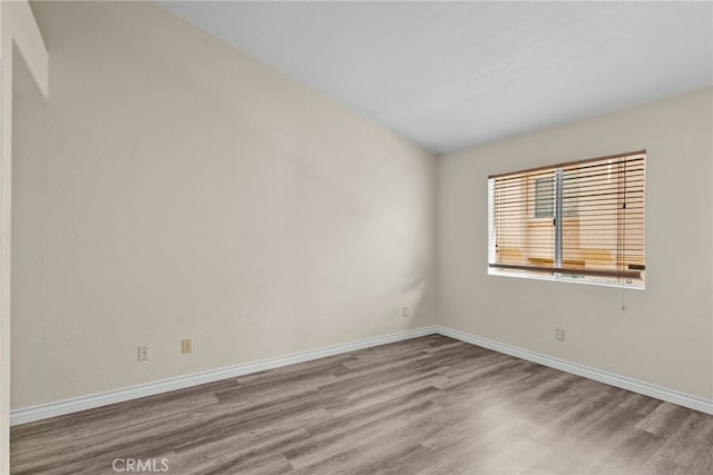 empty room featuring hardwood / wood-style flooring