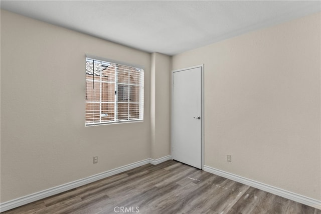 unfurnished room featuring light wood-type flooring