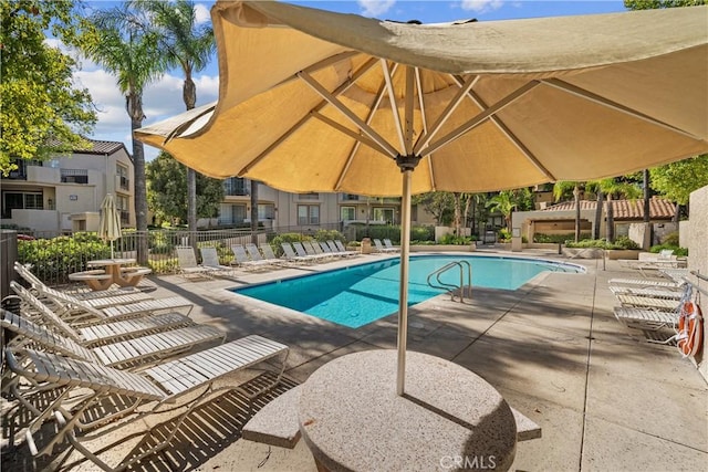 view of swimming pool featuring a patio area