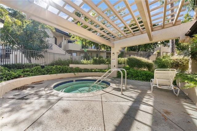 view of swimming pool with a pergola and a hot tub