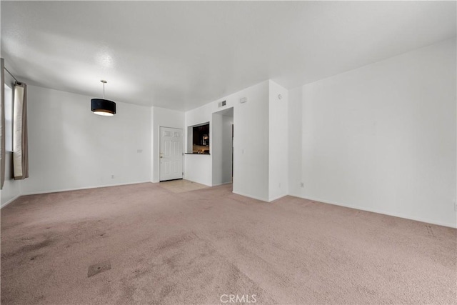 empty room with light colored carpet