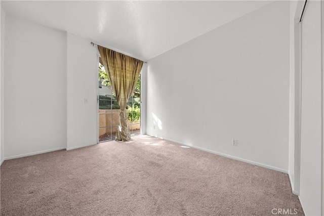 unfurnished room with carpet flooring