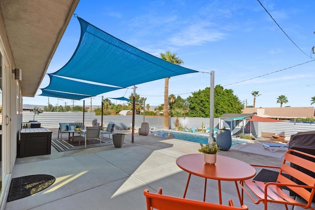 view of patio / terrace with a swimming pool