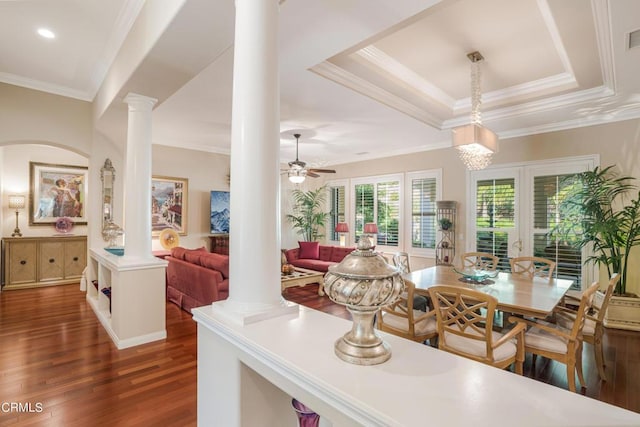 kitchen featuring decorative light fixtures, ceiling fan, crown molding, and decorative columns