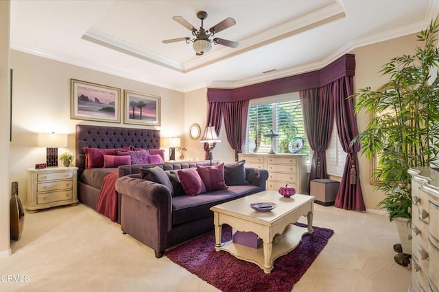 bedroom featuring ceiling fan, ornamental molding, light colored carpet, and a raised ceiling