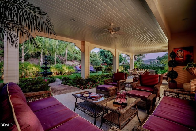 view of patio / terrace featuring ceiling fan and an outdoor living space