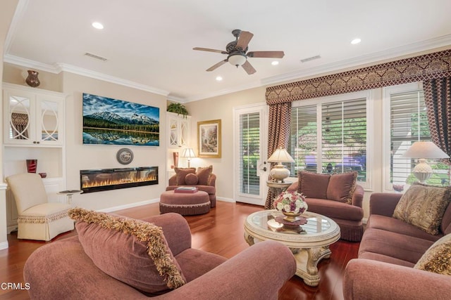 living room with ceiling fan, hardwood / wood-style floors, and crown molding