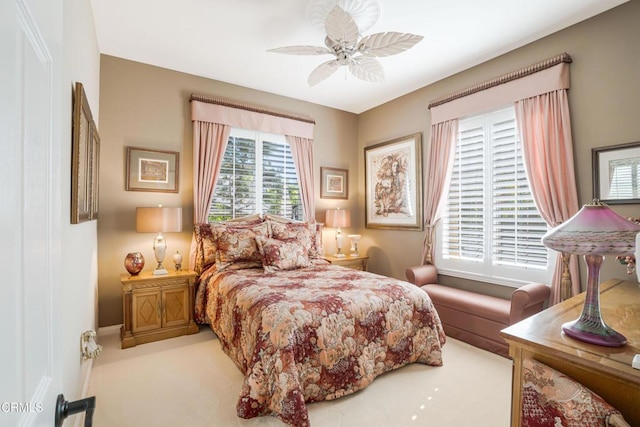 carpeted bedroom featuring ceiling fan