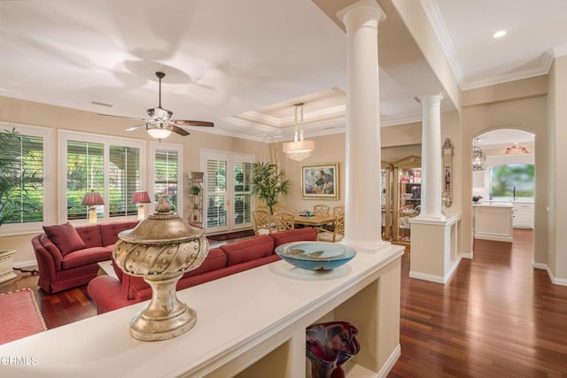 kitchen featuring ceiling fan, dark hardwood / wood-style floors, crown molding, and decorative columns