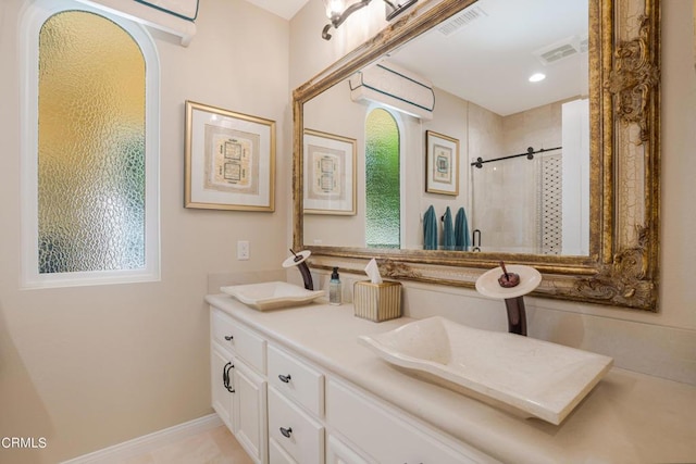 bathroom with vanity and walk in shower