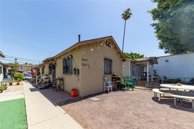 view of property exterior featuring a patio area