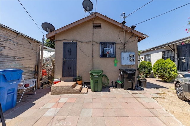 rear view of house featuring a patio