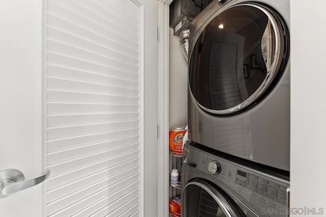 washroom with stacked washer / dryer