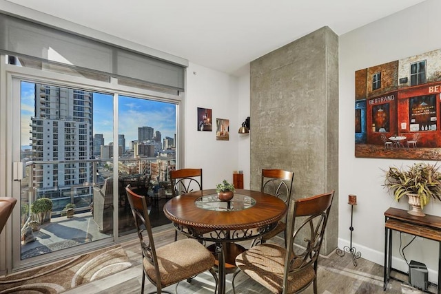 dining area with hardwood / wood-style floors