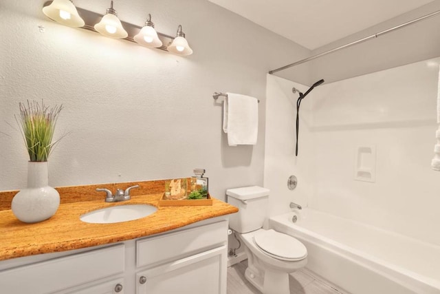 full bathroom featuring vanity, tub / shower combination, and toilet