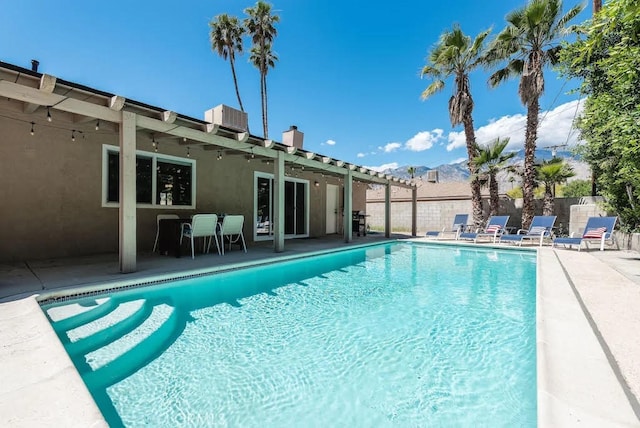 view of swimming pool featuring central AC and a patio area