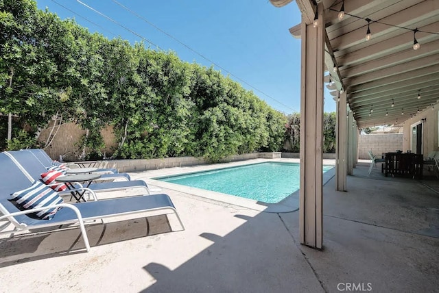 view of swimming pool featuring a patio