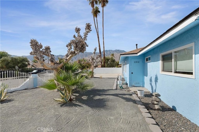 view of yard featuring a mountain view and a patio area