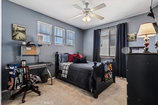 carpeted bedroom with ceiling fan