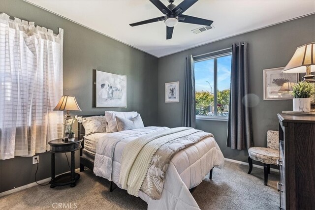 carpeted bedroom with ceiling fan