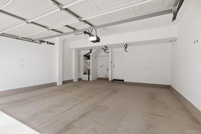 garage featuring water heater and a garage door opener