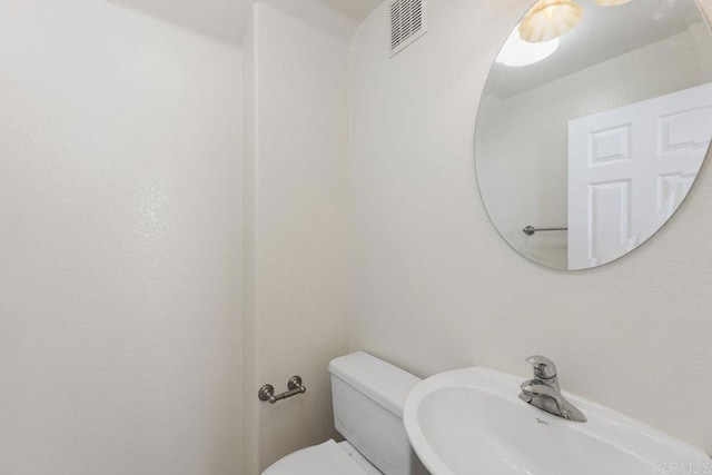 bathroom featuring sink and toilet