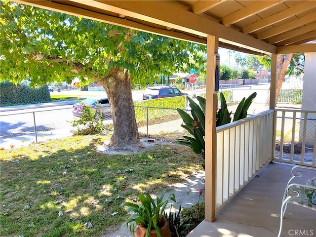 view of patio with a porch and fence