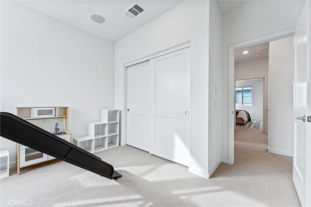 workout room with light carpet