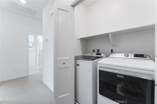 laundry room with independent washer and dryer