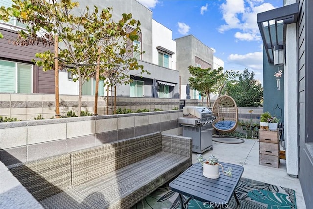 balcony with a patio, an outdoor hangout area, and a grill