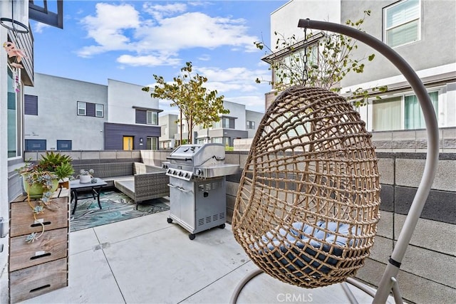 view of patio with grilling area and an outdoor hangout area