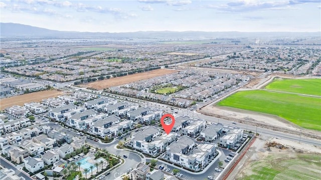 birds eye view of property with a mountain view