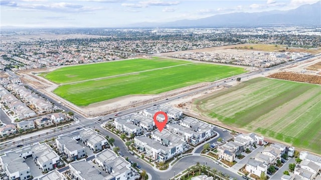 birds eye view of property with a mountain view