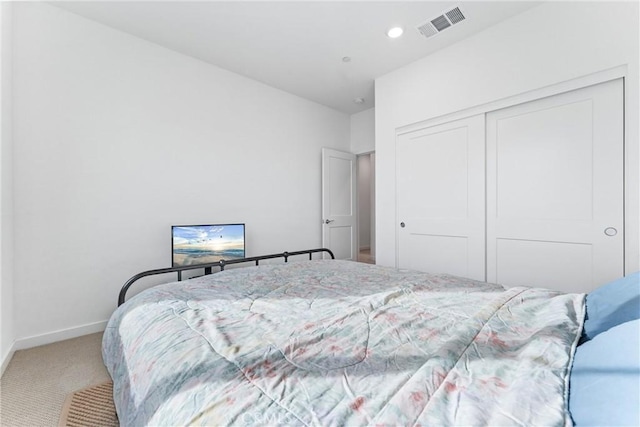 bedroom featuring carpet and a closet