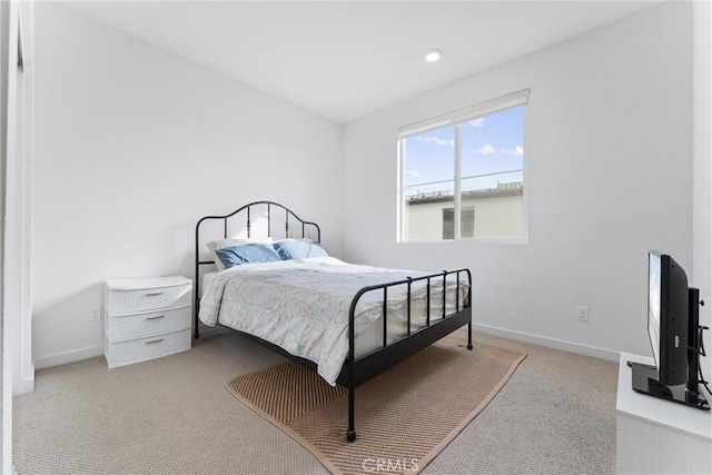 bedroom with light colored carpet