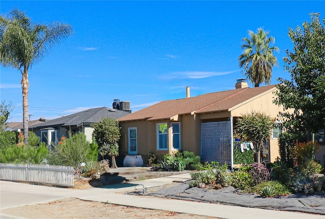 single story home with central AC unit