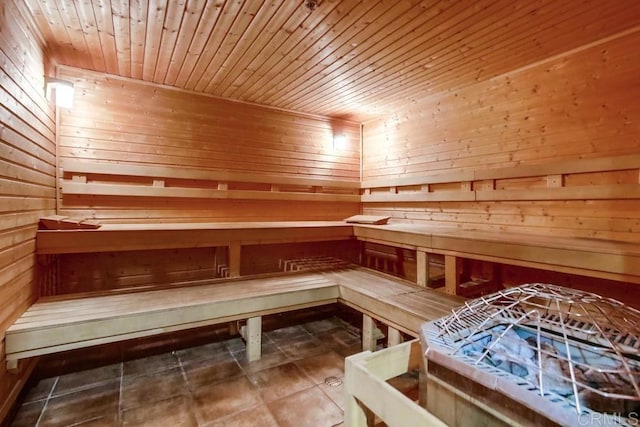 view of sauna featuring wood walls, wooden ceiling, and tile patterned flooring