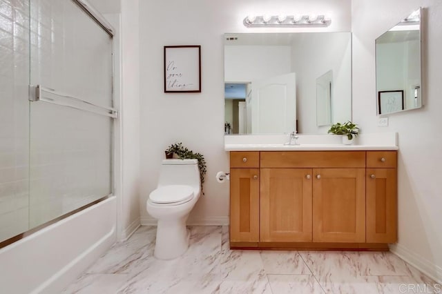 full bath with marble finish floor, combined bath / shower with glass door, toilet, vanity, and baseboards