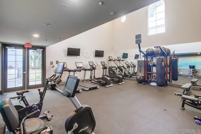workout area featuring a high ceiling