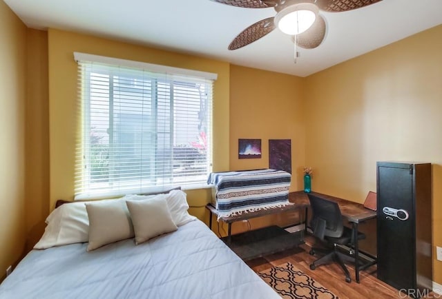 bedroom featuring wood finished floors and ceiling fan