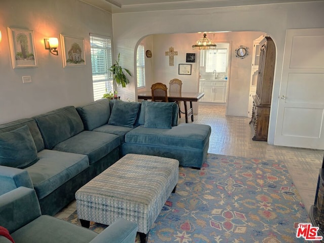 living room featuring sink and hardwood / wood-style flooring