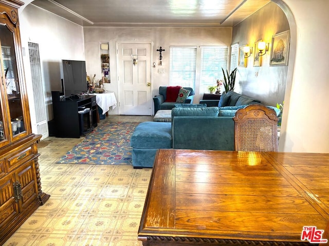 dining space featuring crown molding