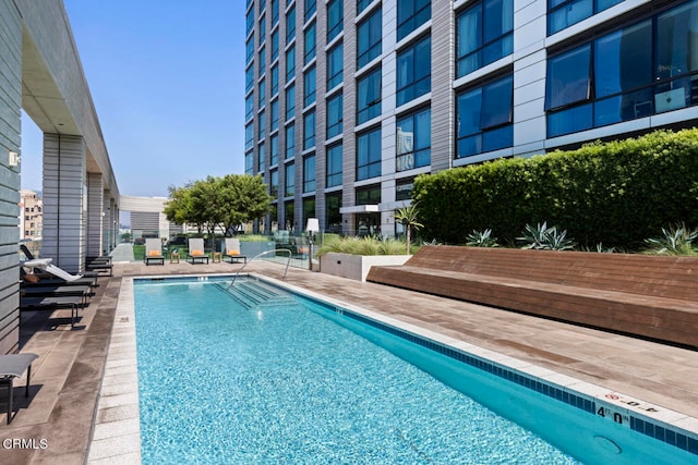 view of swimming pool featuring a patio area